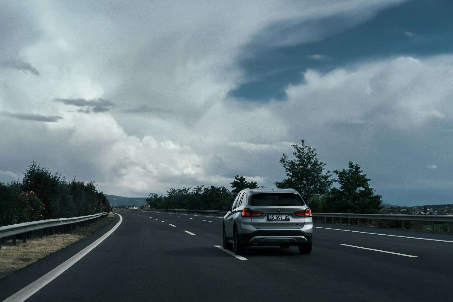 A modern vehicle driving on a safe, open road representing freedom and protection